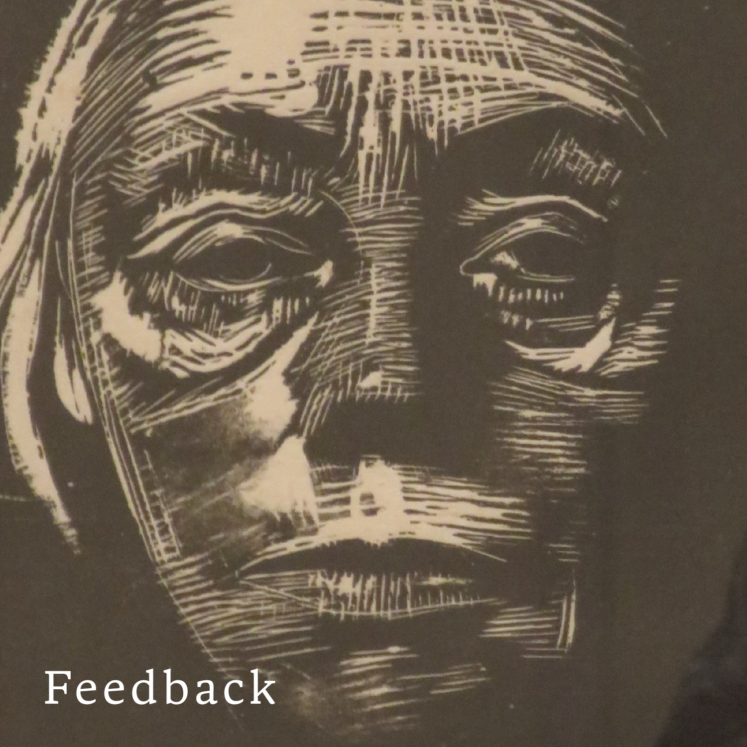 Close up of a woman's face carved in wood
