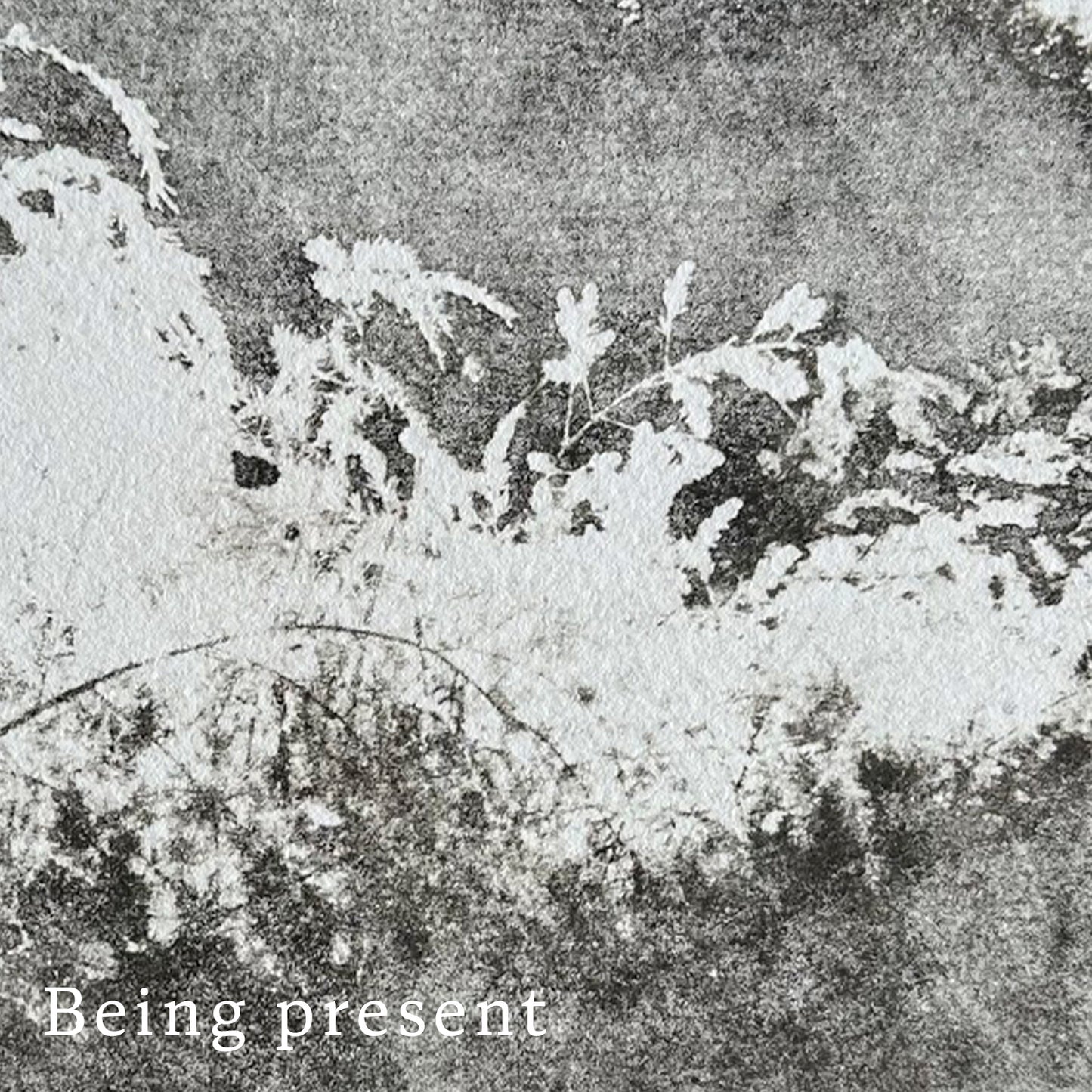 Text 'Being present' on a hand printed, sepia toned textured quality paper background