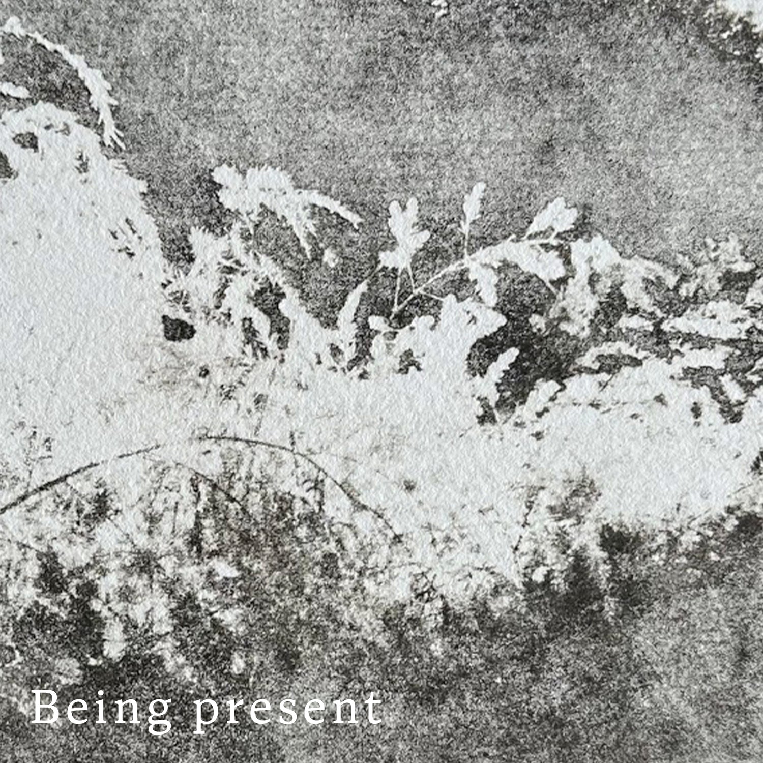 Text 'Being present' on a hand printed, sepia toned textured quality paper background